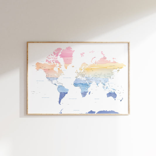 Framed world map with watercolor design on a white wall
