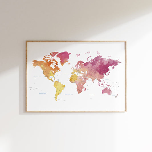 Framed world map with watercolor design on a white wall