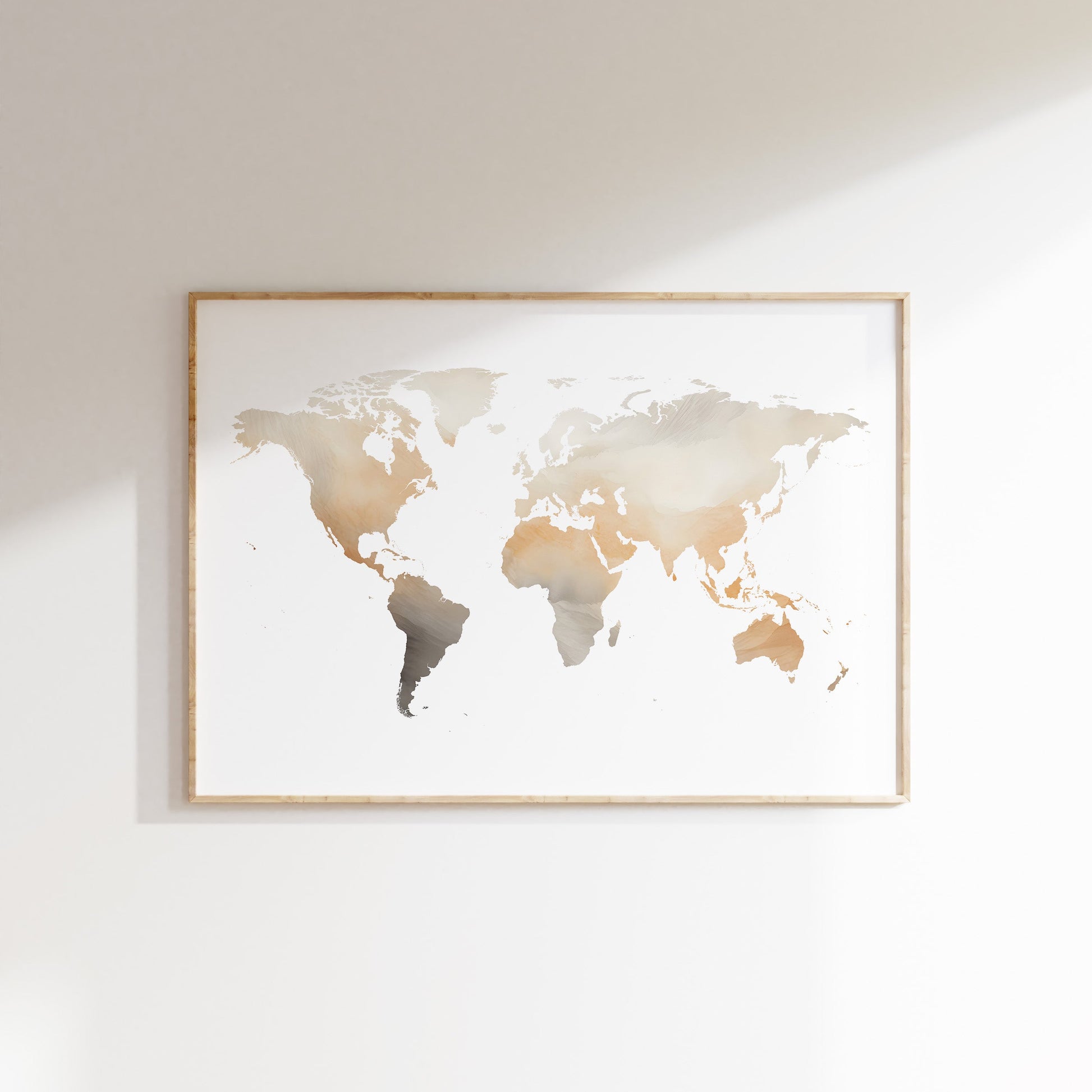 World map poster in a gold frame on a white wall