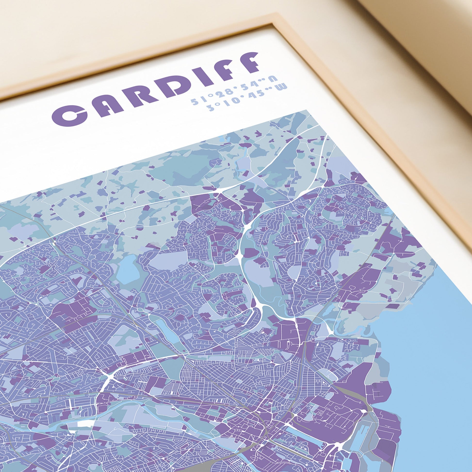 Cardiff city map poster in a wood frame.