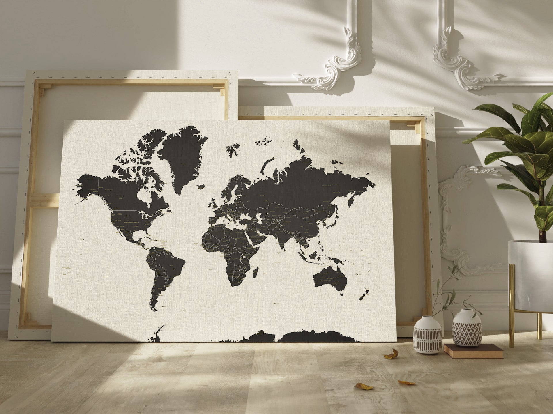 World mapprint on canvas on a wall with decorative elements.