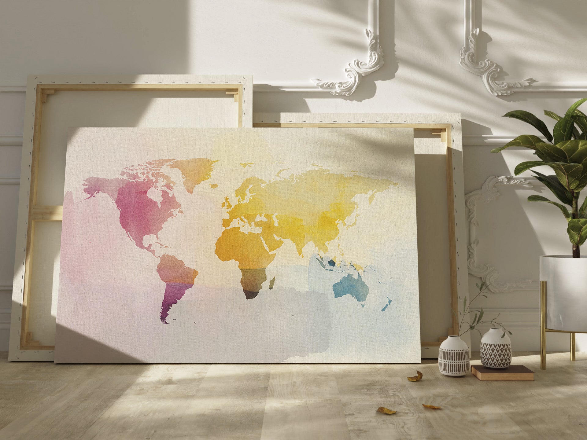 Colorful world mapprint on canvas on a light wooden floor with a plant in the background.