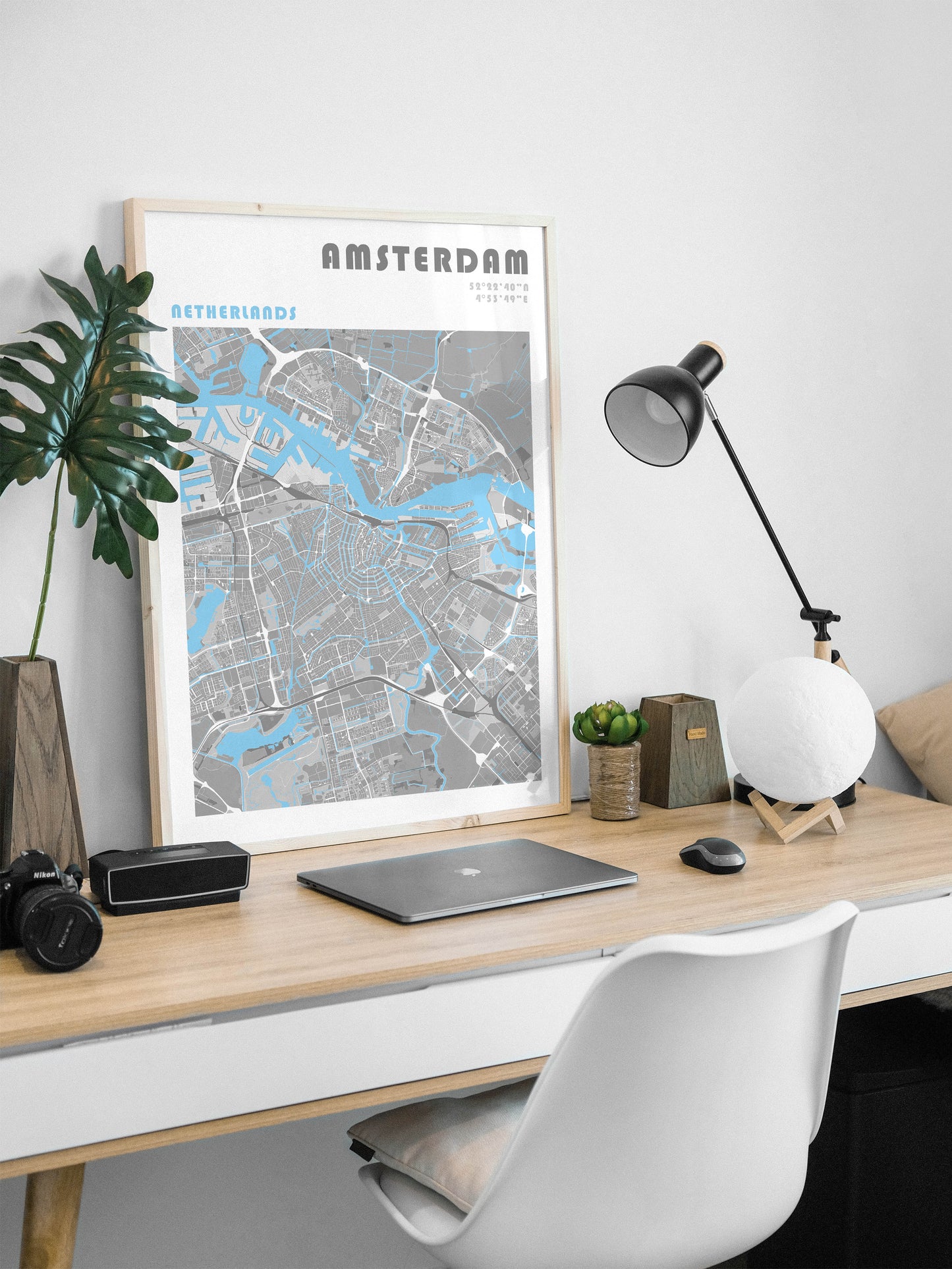 Amsterdam travel map print in a wood frame.
