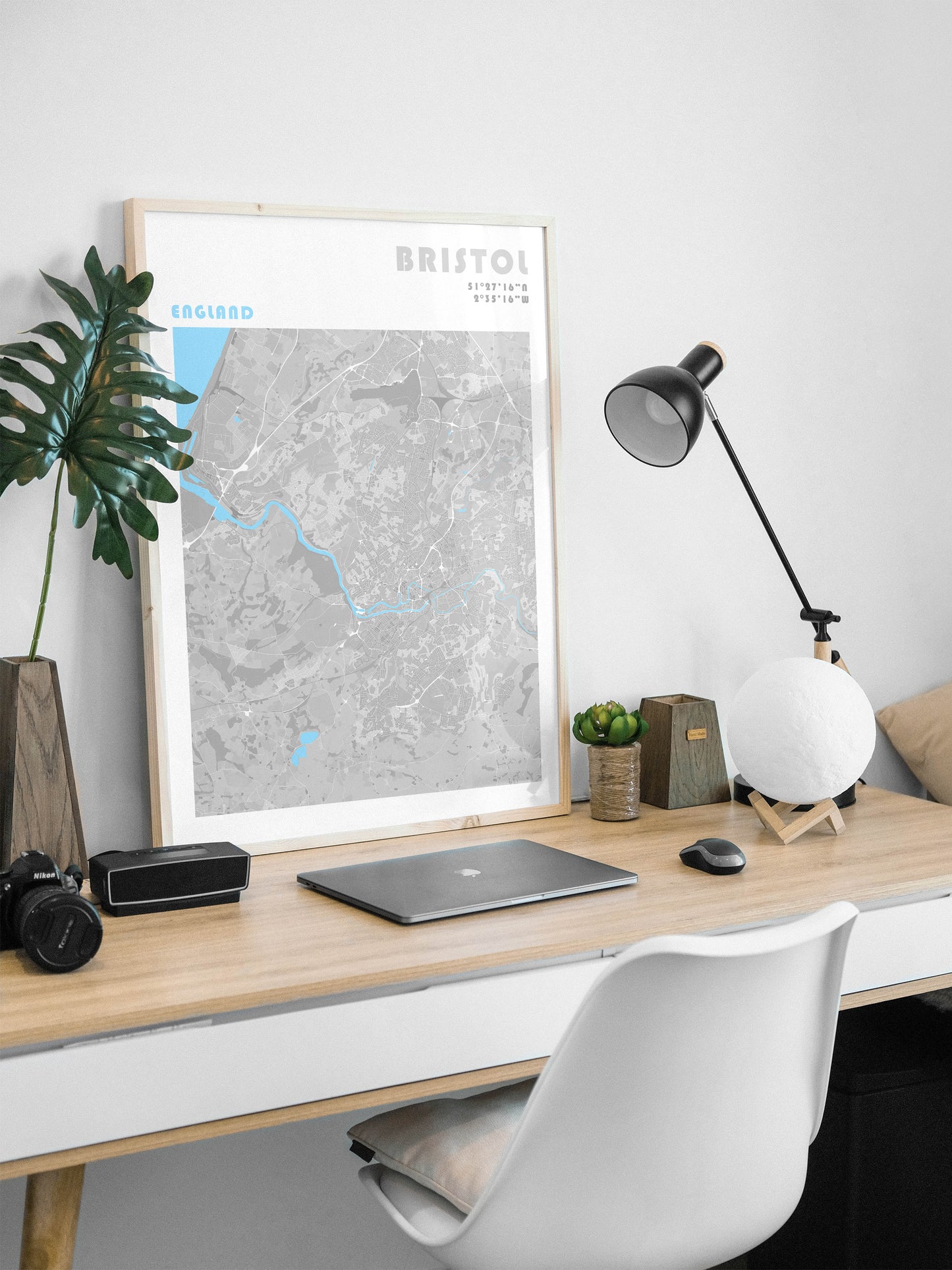 Bristol travel map poster in a natural wood frame.