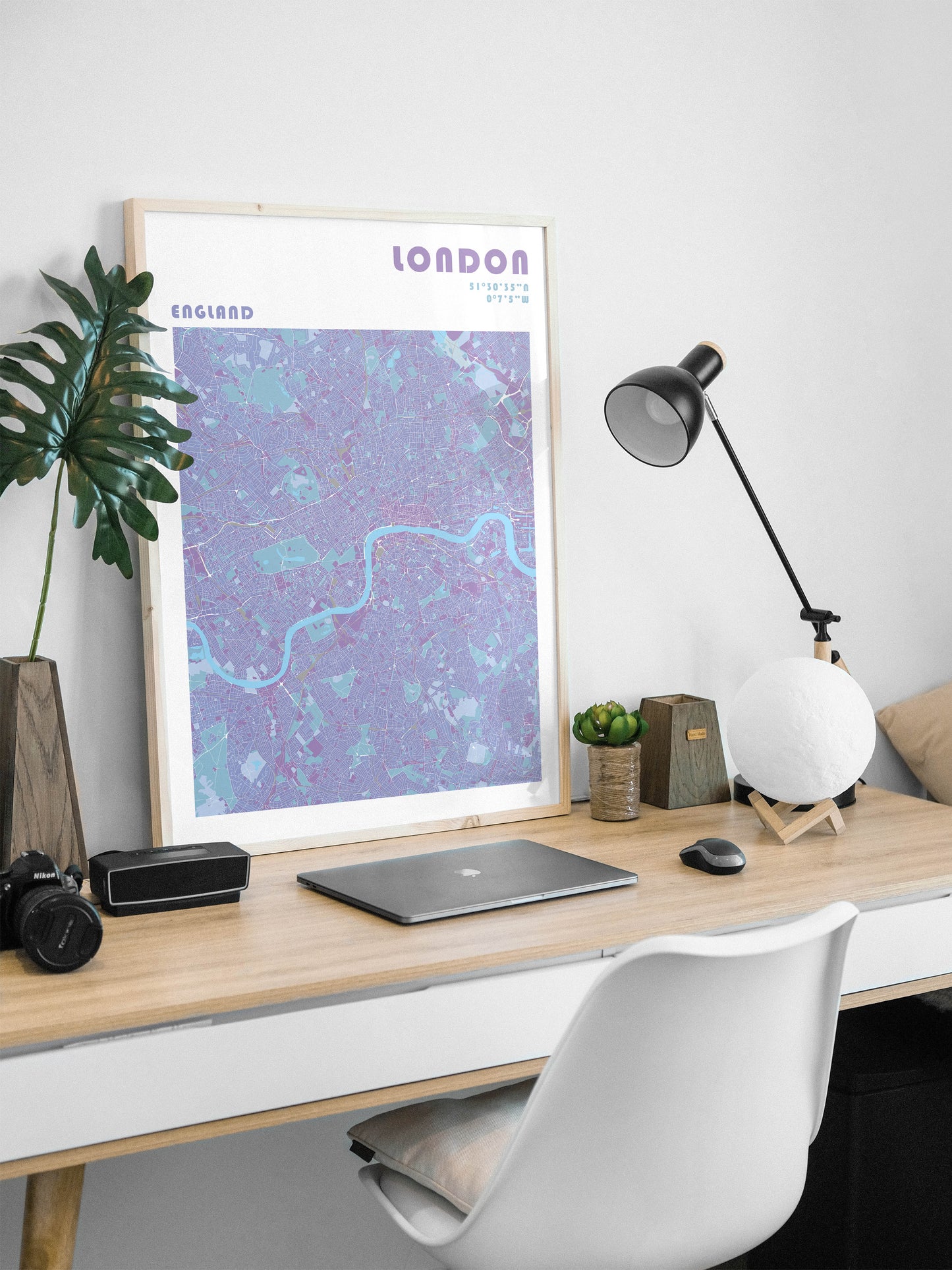 London city map print in a wood frame.