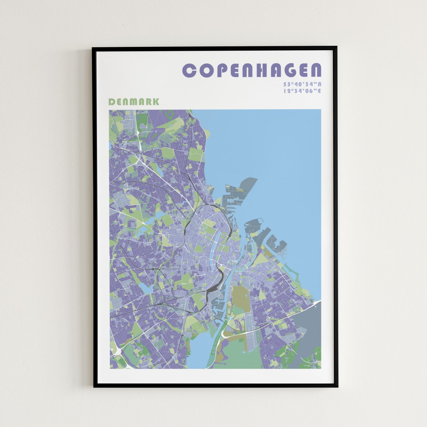 Copenhaguen travel map poster in a black frame.