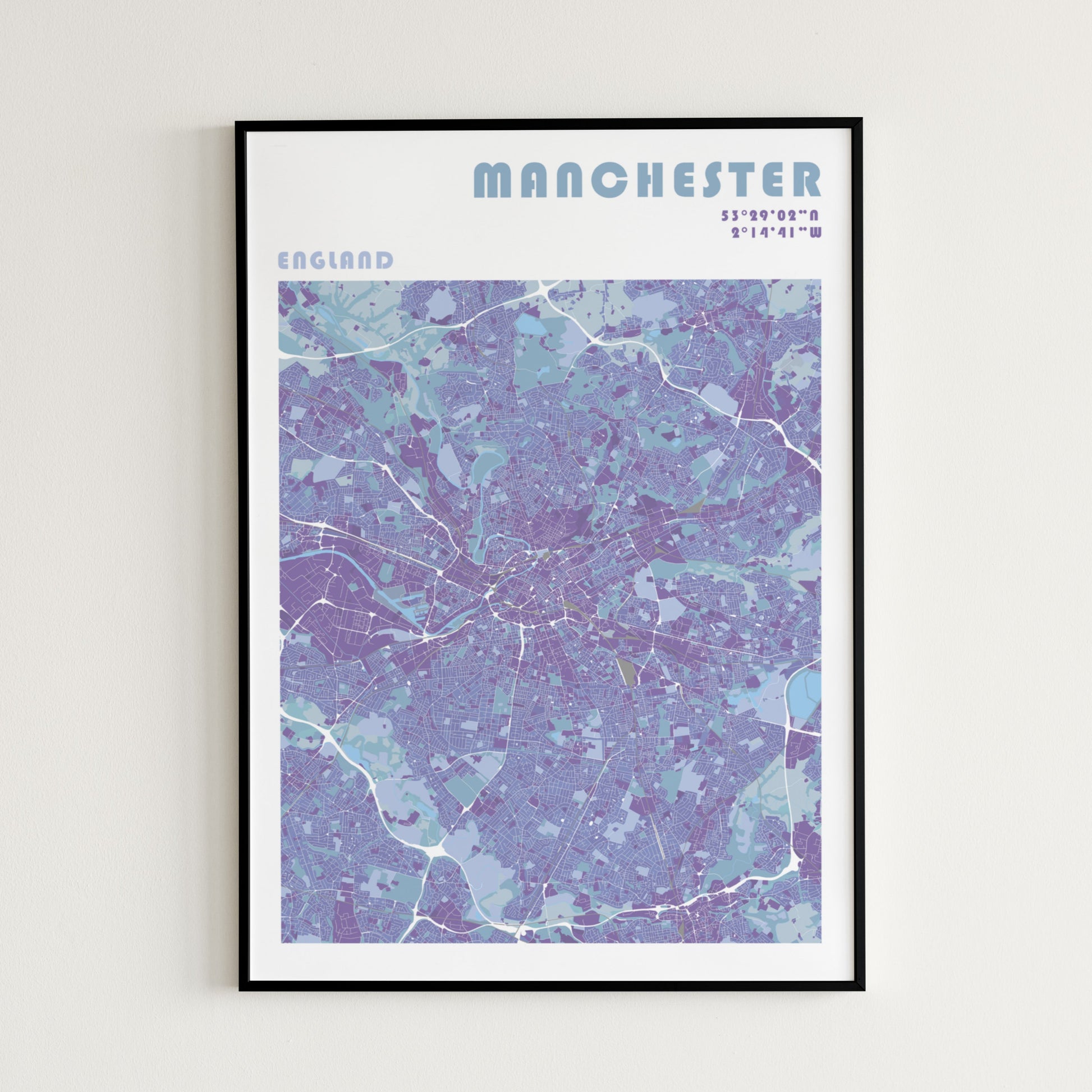Manchester travel map poster in a black frame.