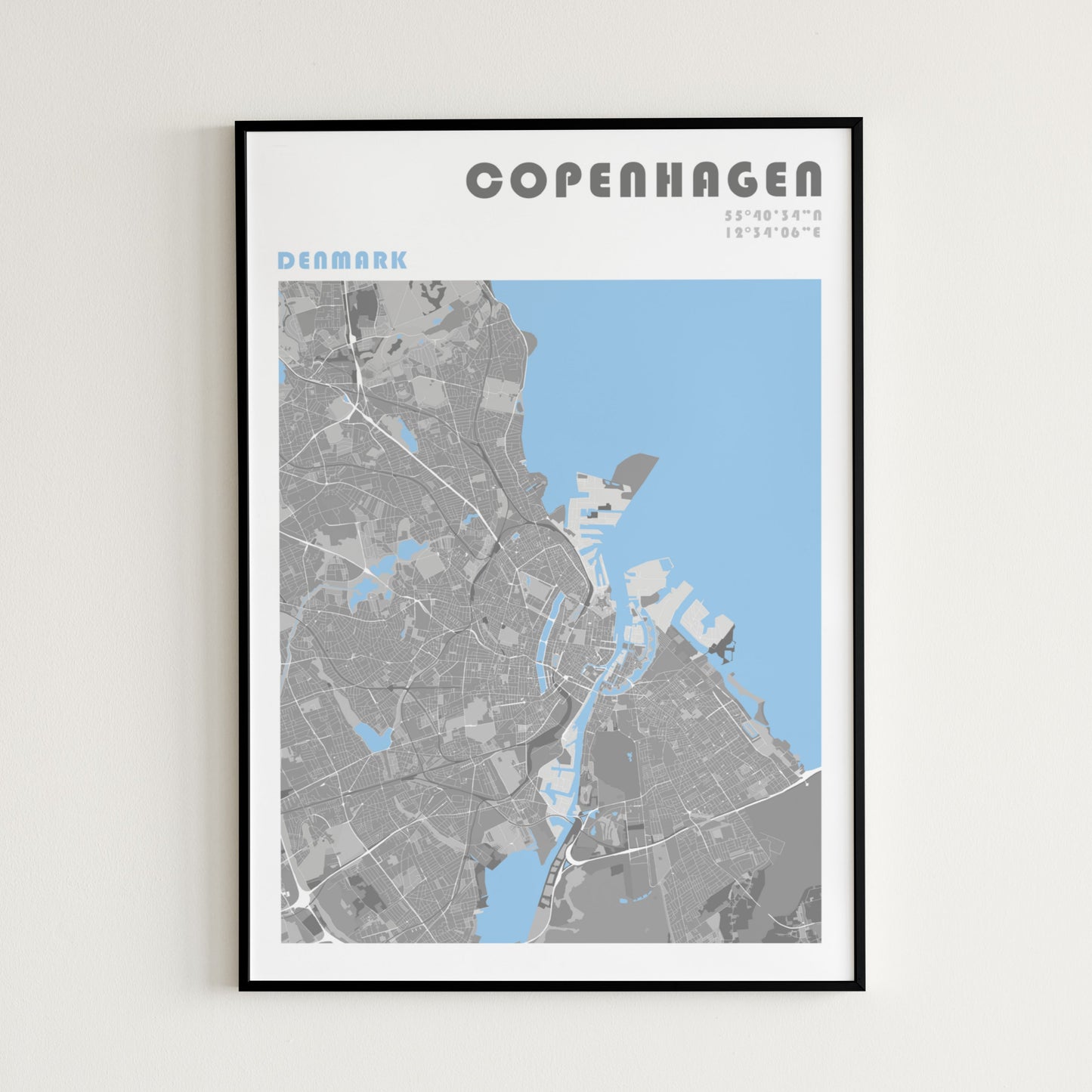 Copenhaguen travel map poster in a black frame.