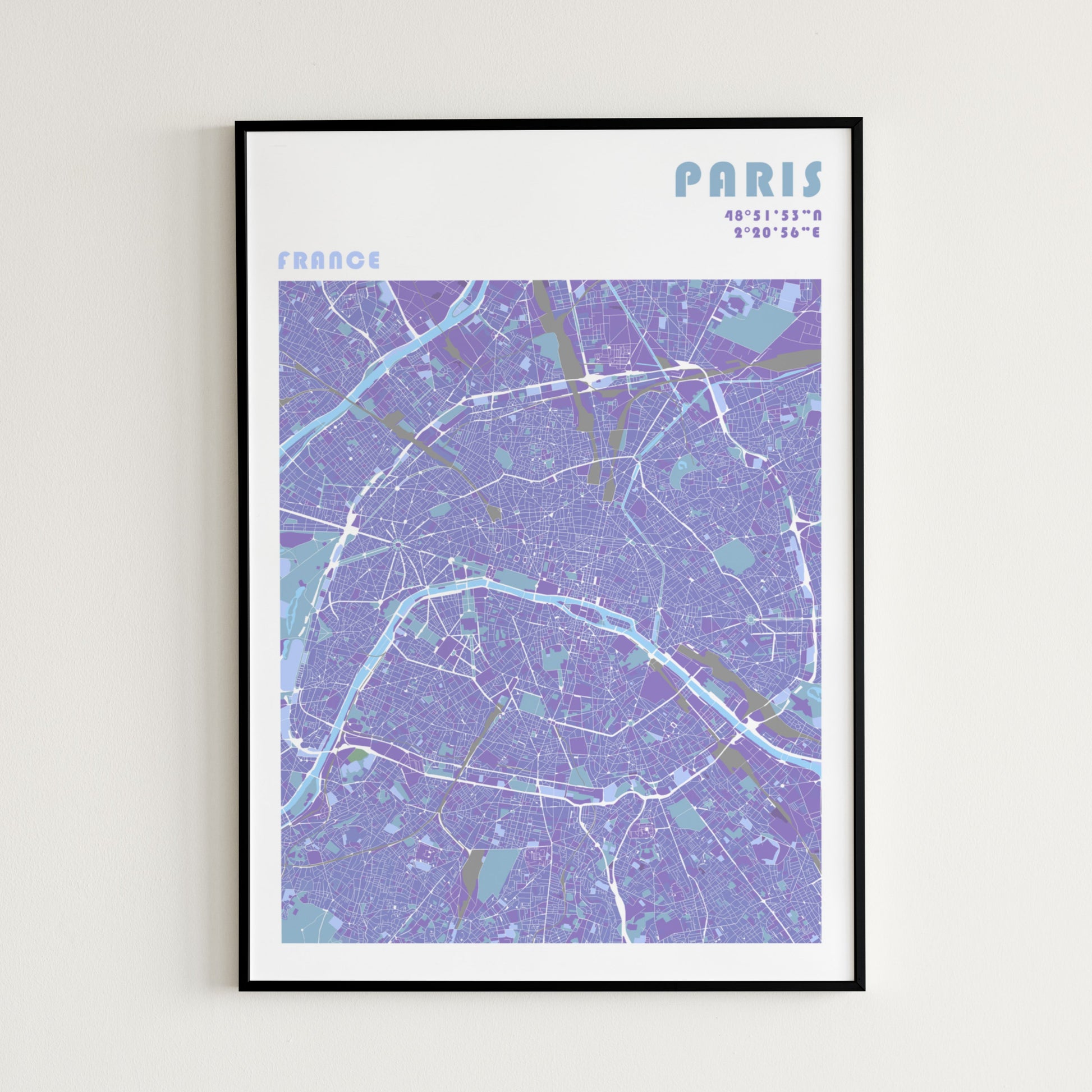 Paris travel map poster in a black metal frame.