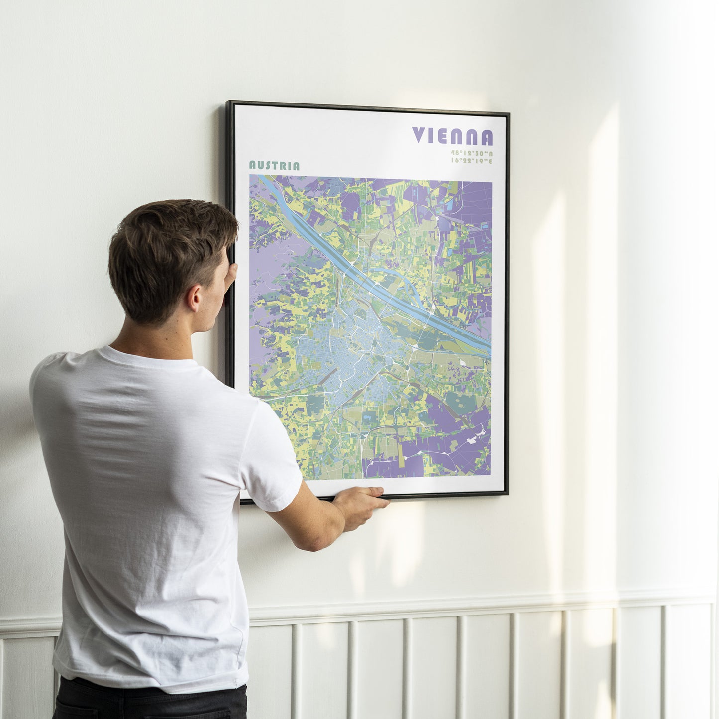 Vienna city map print in a black metal frame.