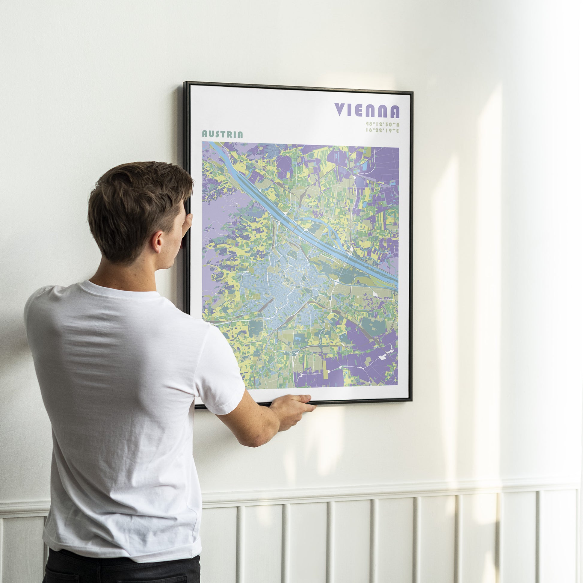 Vienna city map print in a black metal frame.