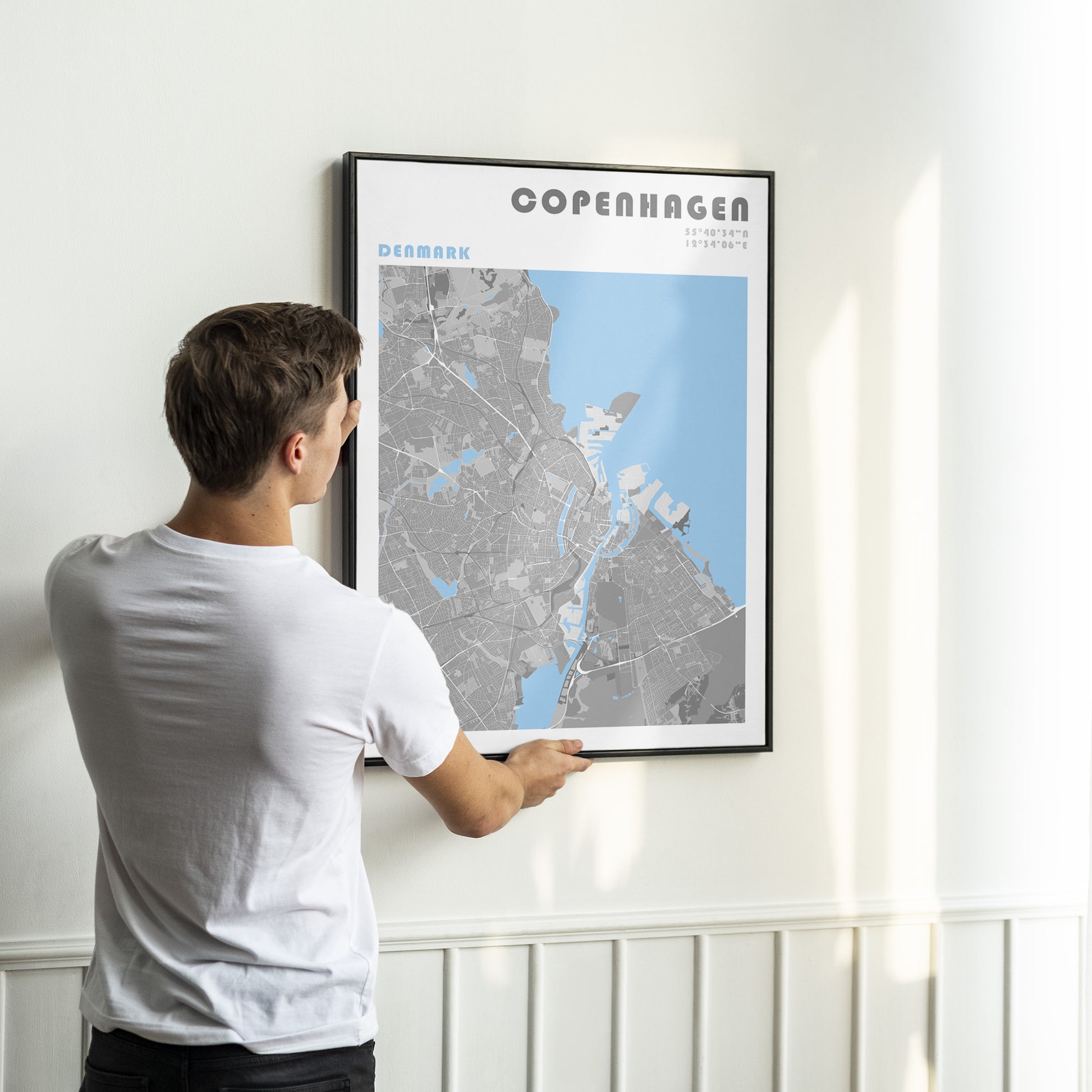 Copenhaguen poster in a black frame.