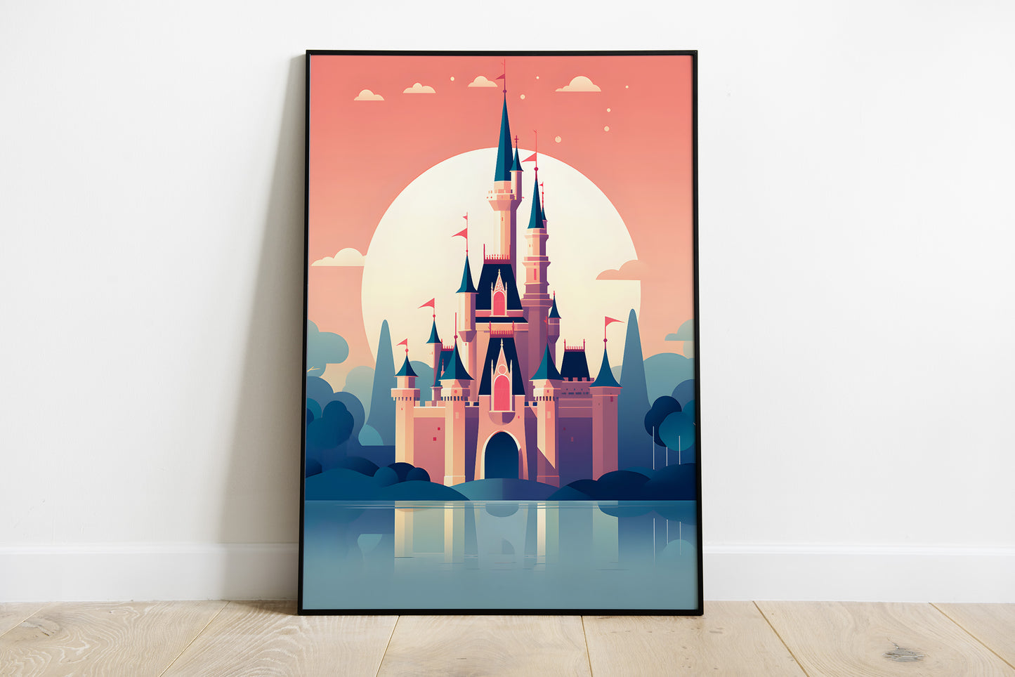 A framed vertical art print leaning against a white wall on a light wood floor. The print shows a stylized pink castle with blue spires in front of a large pale sun and blue sky, with the castle reflected in water below.