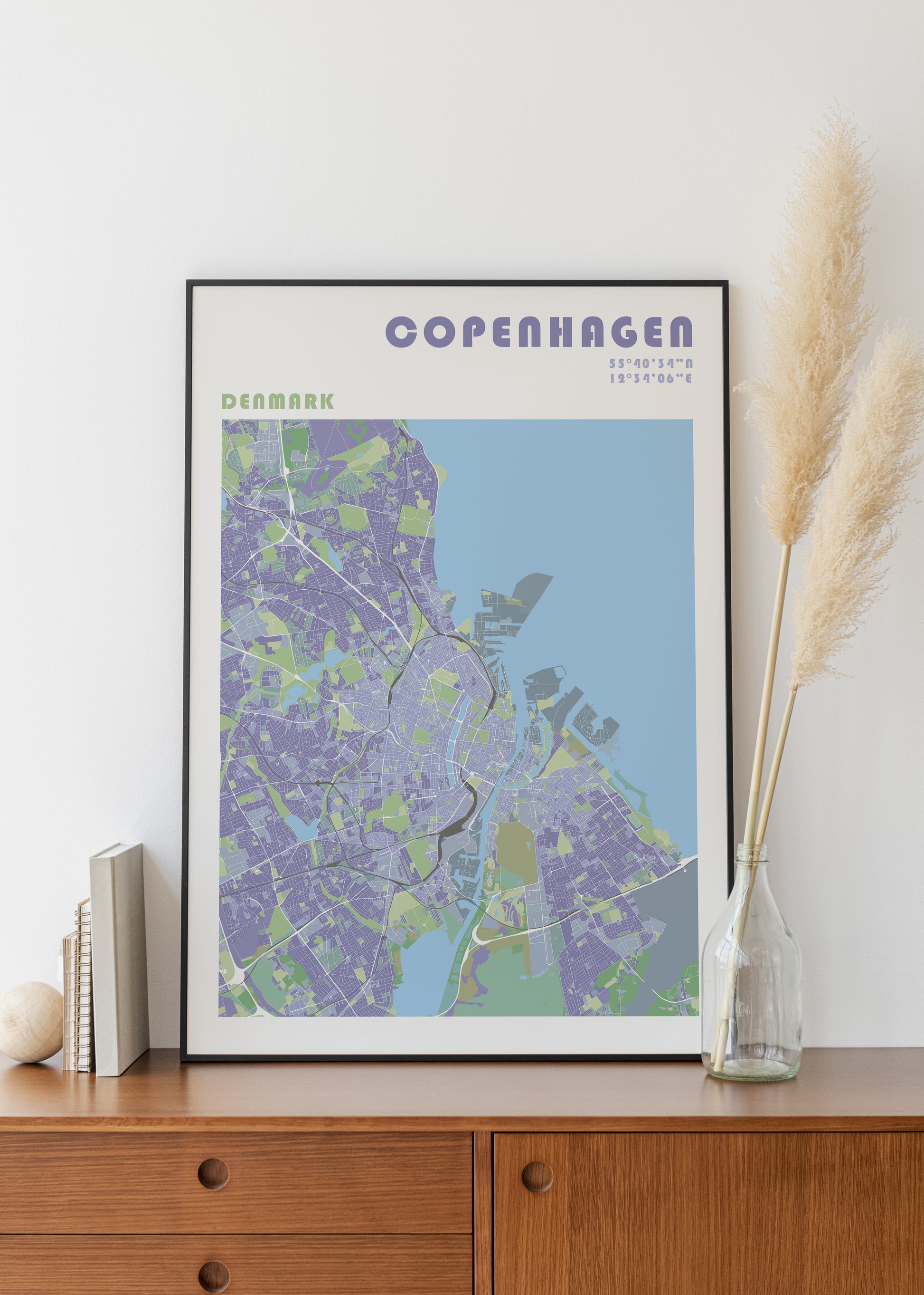Copenhaguen city map print in a black frame.