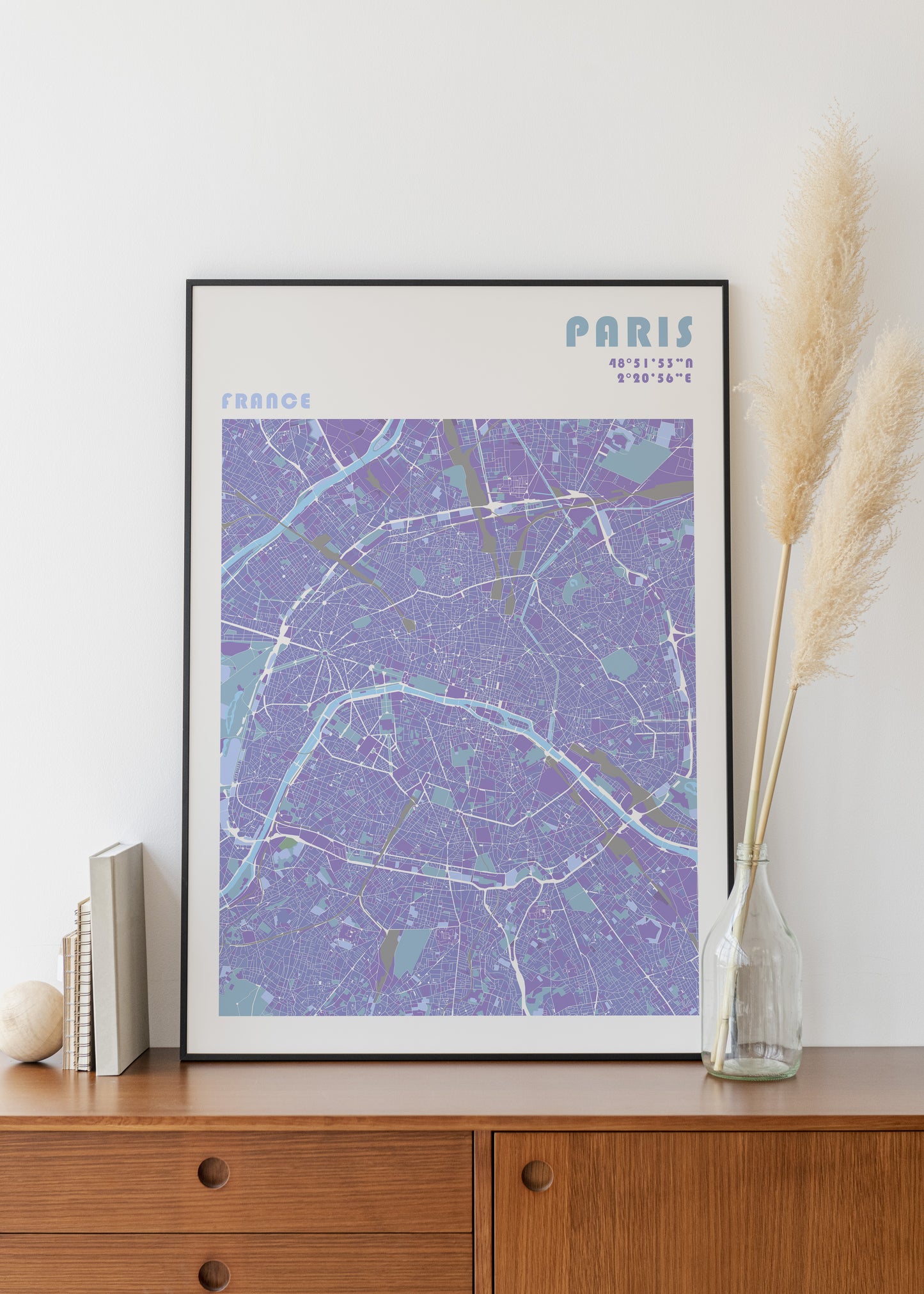 Paris travel map print in a black metal frame.