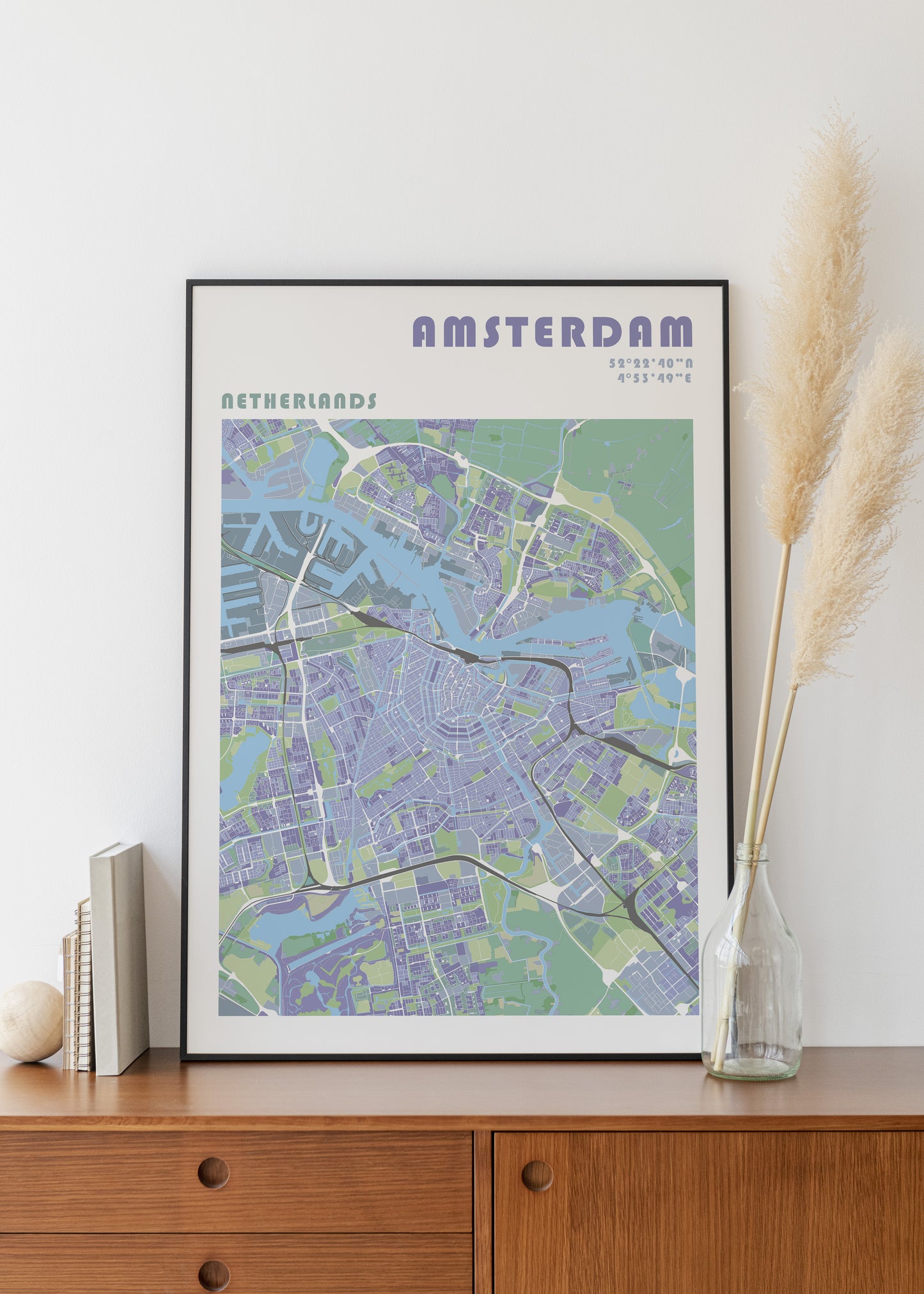 Amsterdam travel map poster in a black frame.