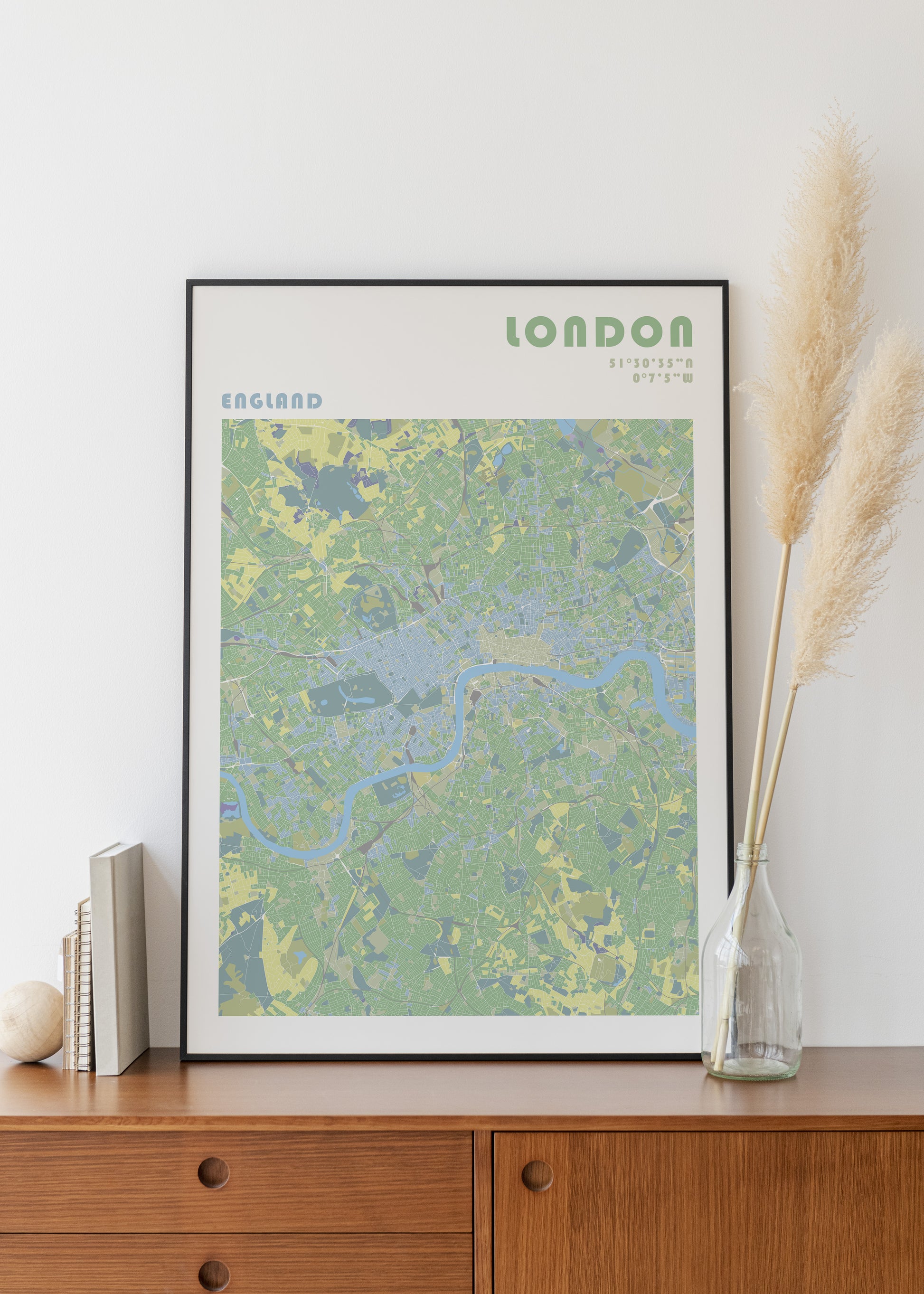 London travel map poster in a black metal frame.