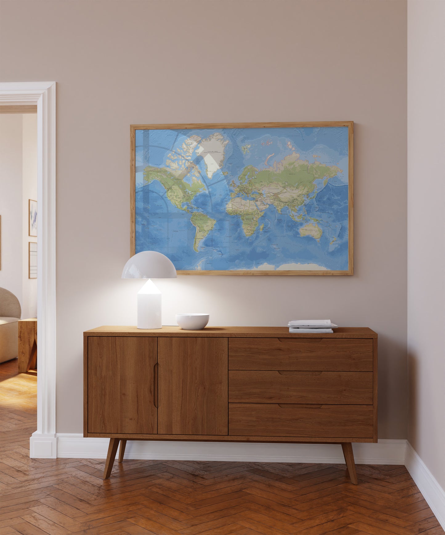 Physical map of the world print in a natural wood frame.