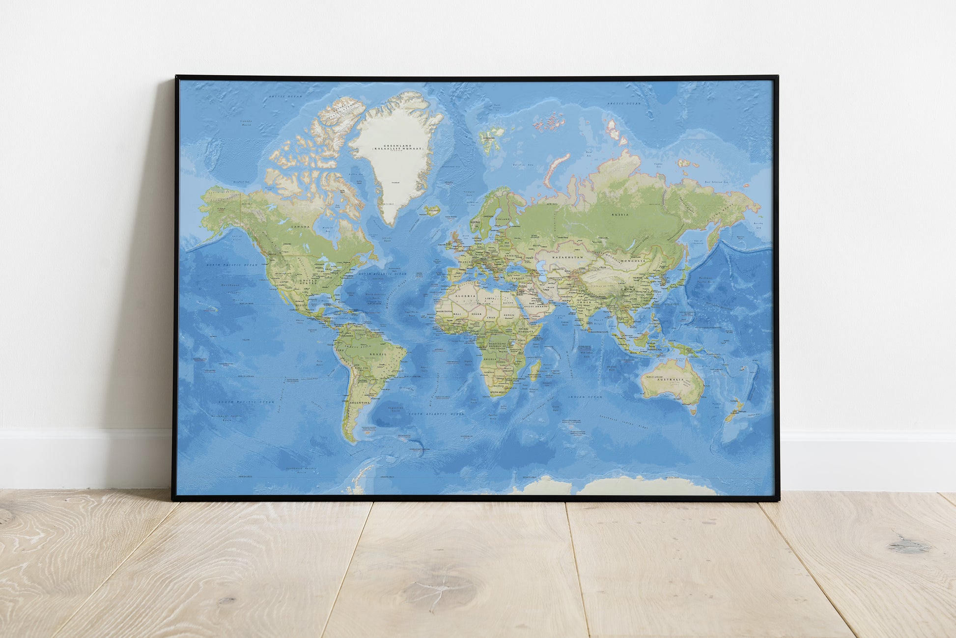 Political map of the world with countries in a black metal frame.
