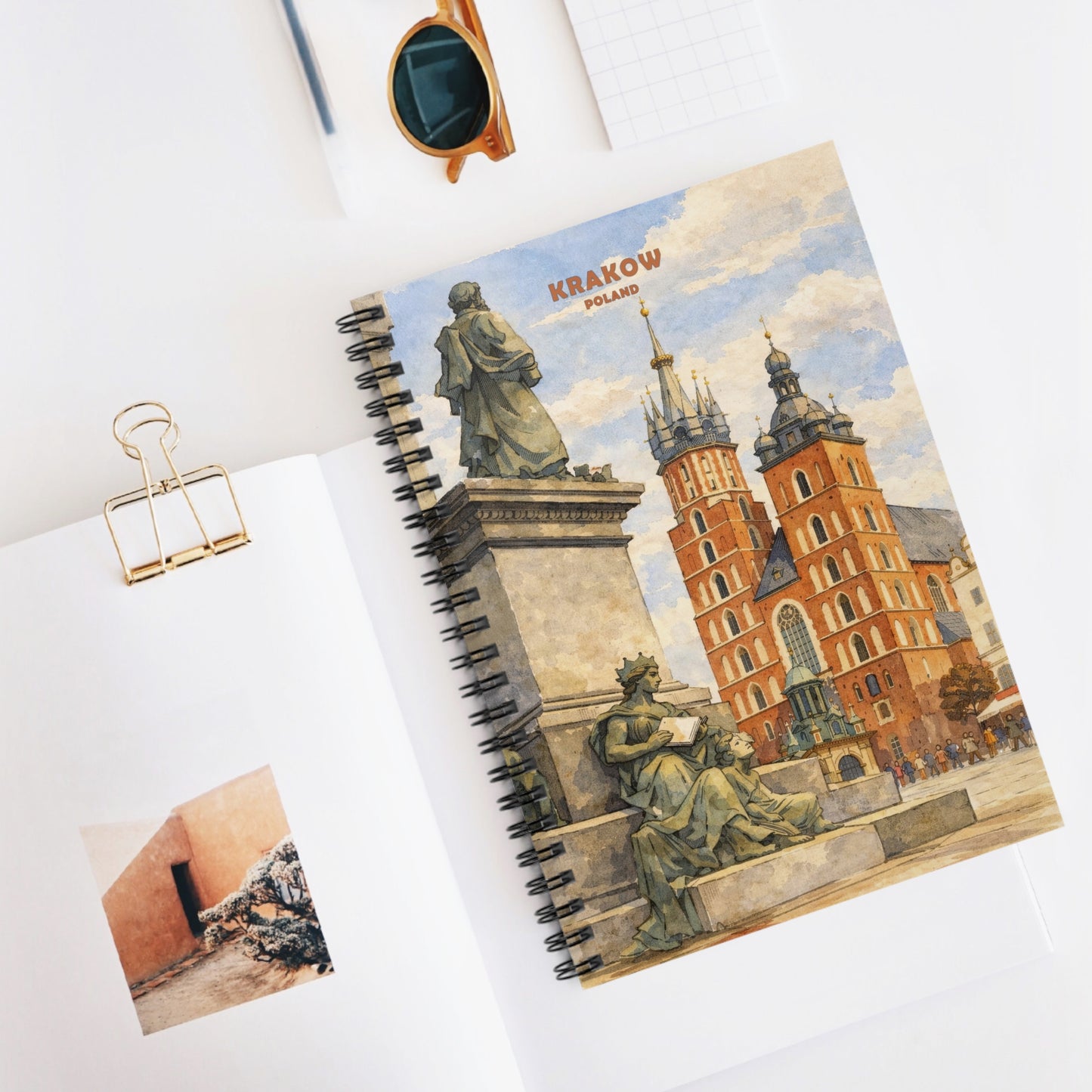 Notebook with Krakow, Poland cover design on a white surface