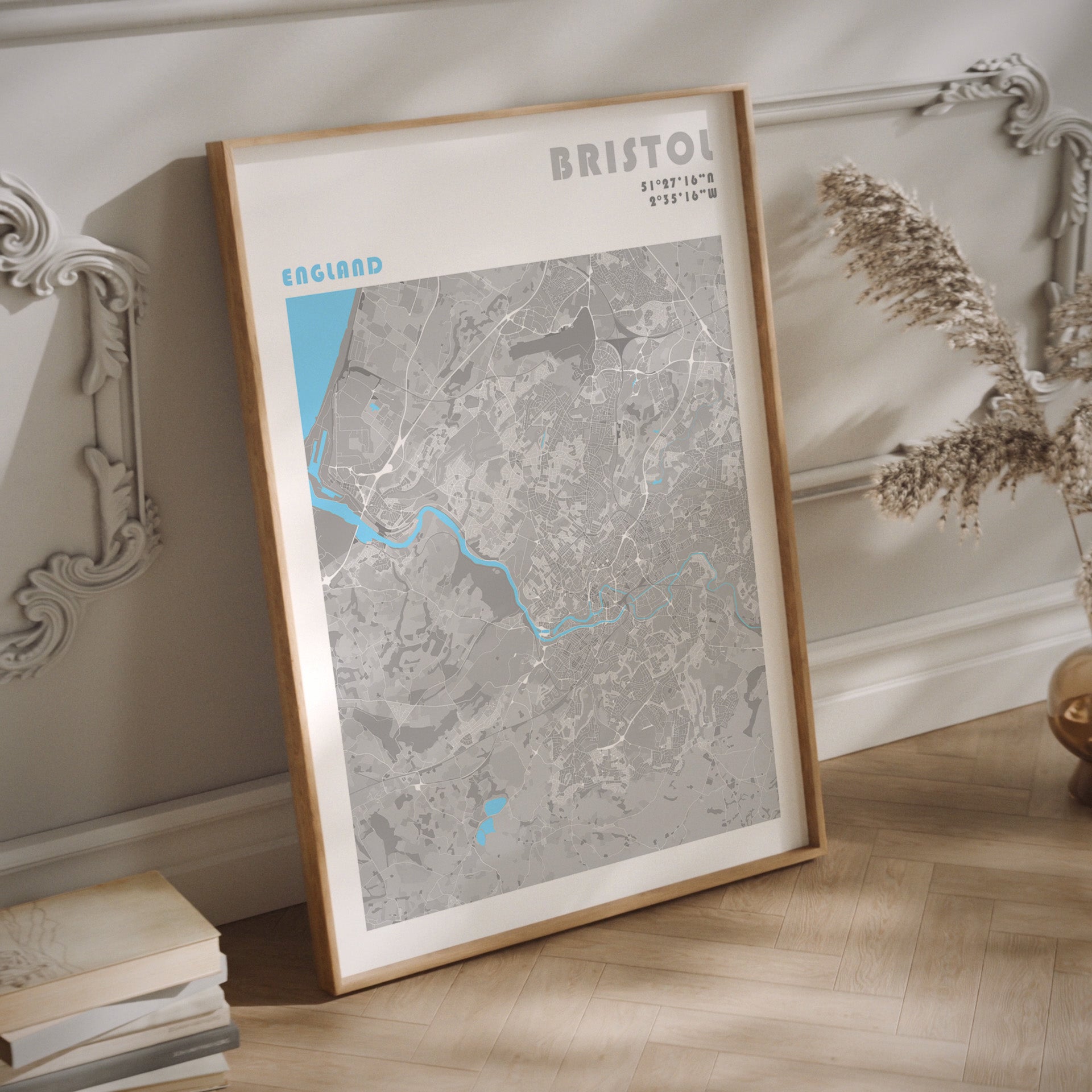 Bristol city map print in a dark wood frame.