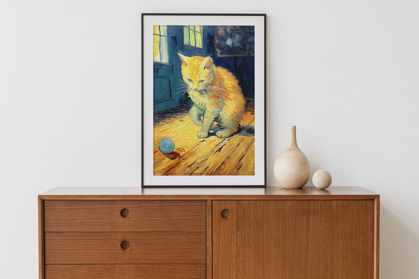 Ginger cat wall art print in a black metal frame.