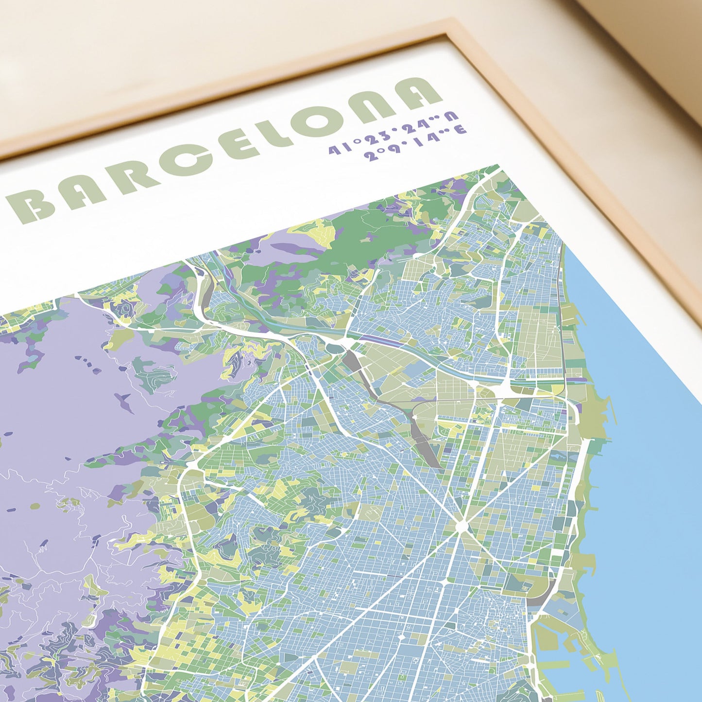 Barcelona travel map poster in a wood frame.