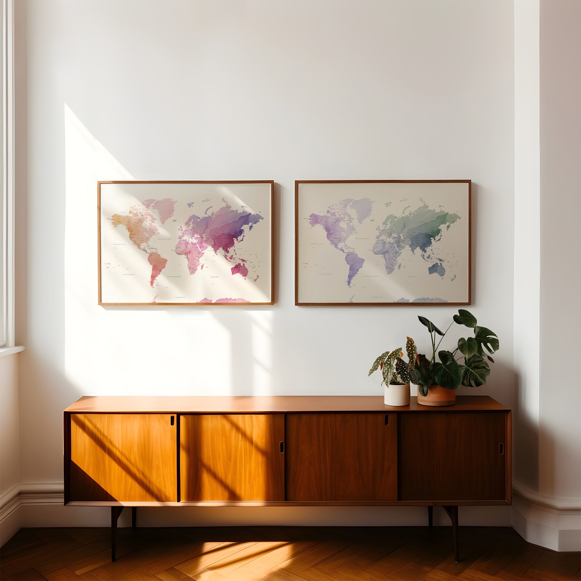 Colorful watercolour world maps in dark wood frames.