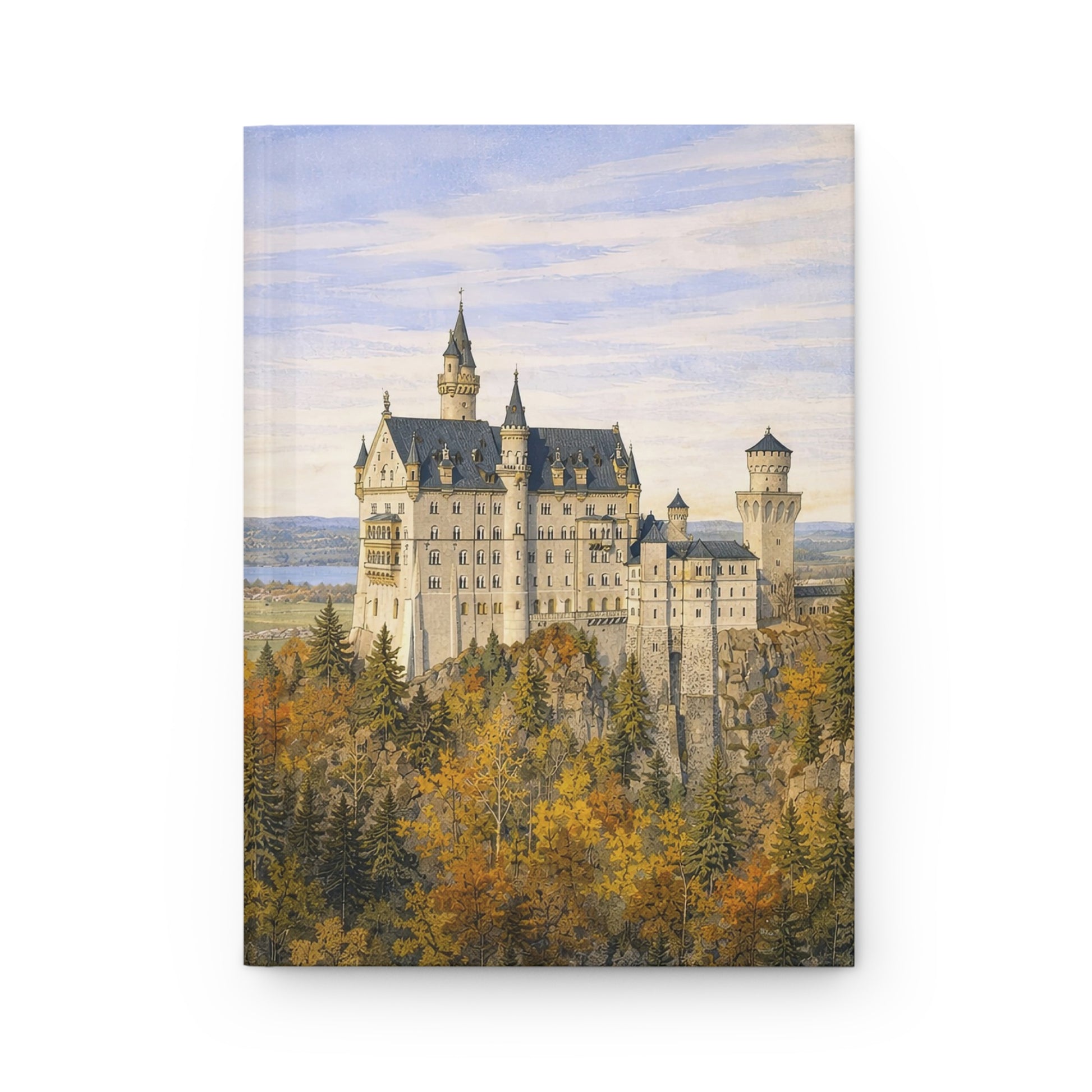 Nesuchwanstein Castle surrounded by trees with a blue sky hardback journal
