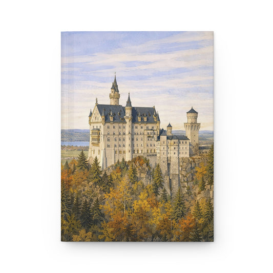 Nesuchwanstein Castle surrounded by trees with a blue sky hardback journal