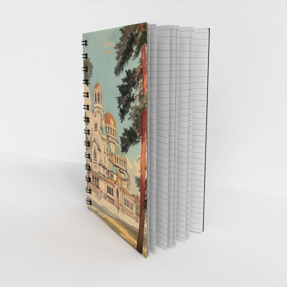 Notebook with a colorful illustration of a church on the cover, displayed against a white background.