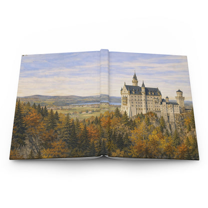 Open journal with a scenic illustration of a castle and forest on a white background