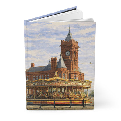 Notebook with a design of Cardiff Bay with a clock tower and the Millenium Centre in South Wales.