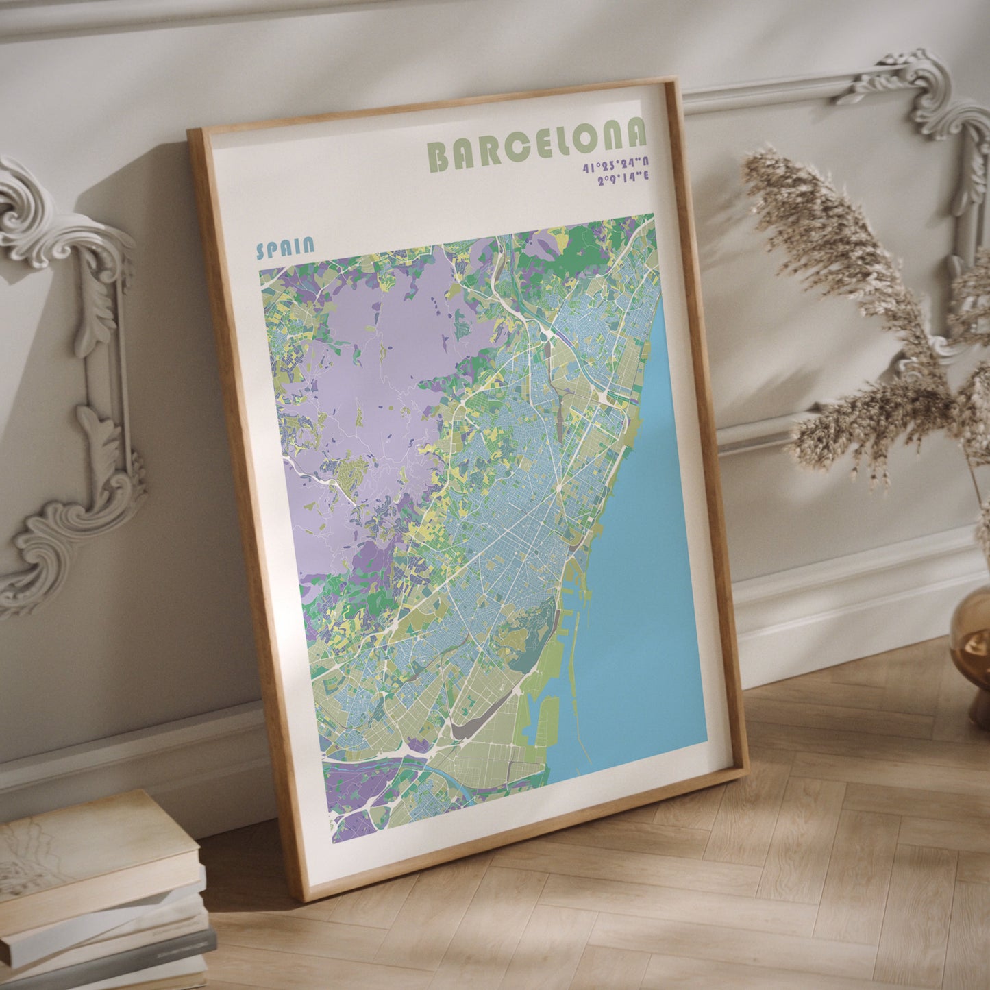 Barcelona city map print in a natural wood frame.