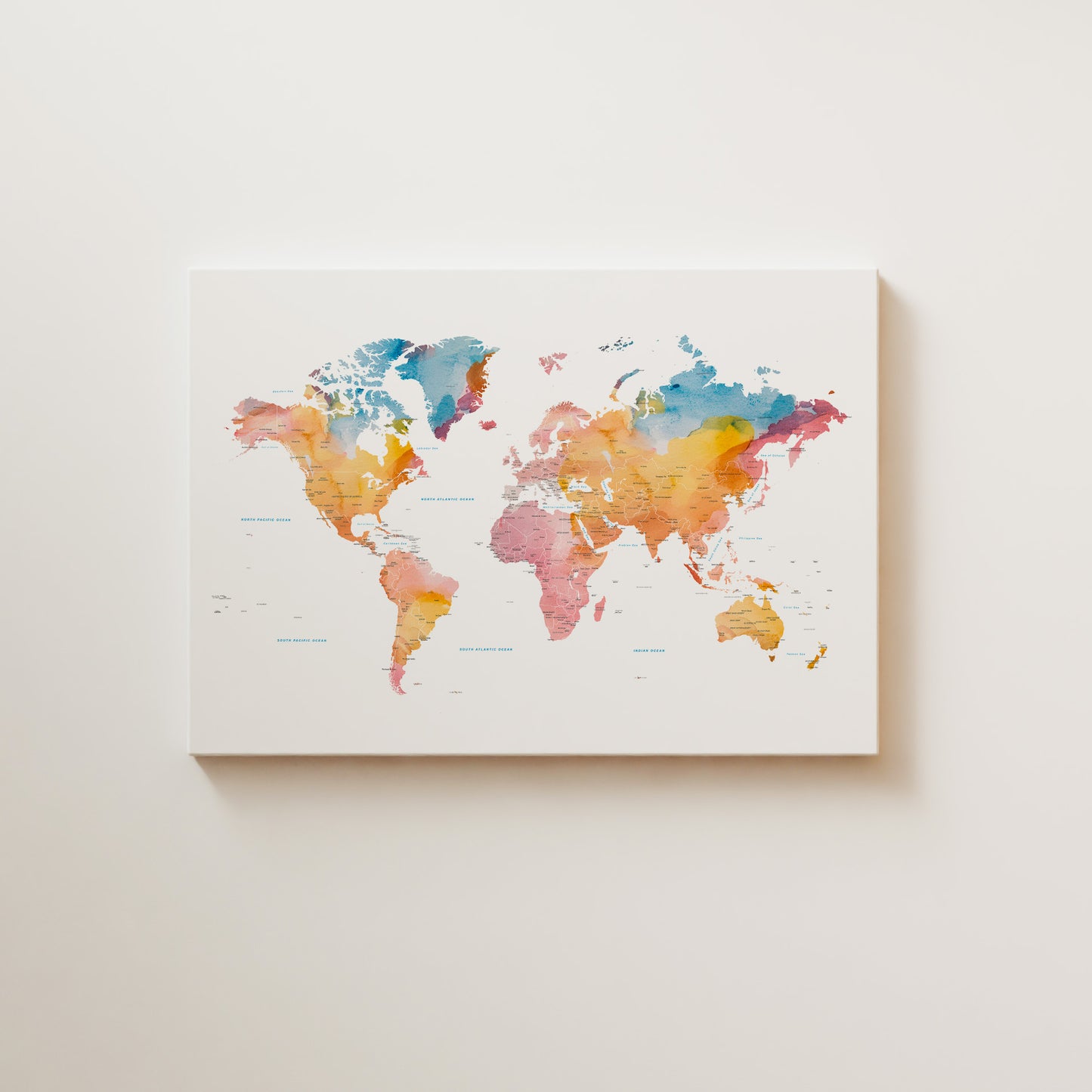 Minimalist world map canvas wall art in beautiful watercolors.