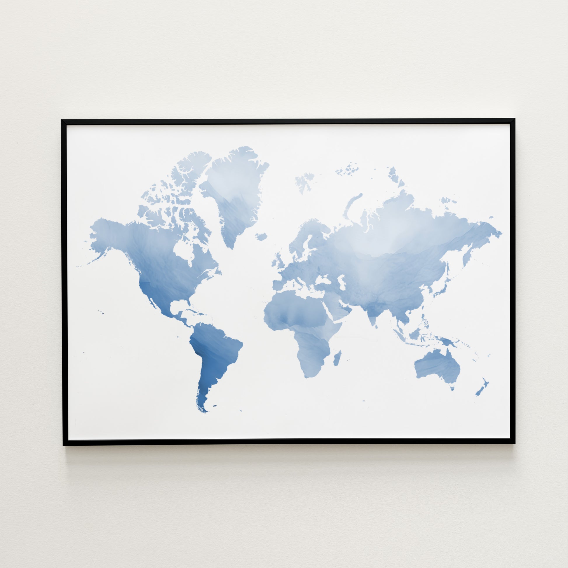 Watercolor blue world map in a black metal frame.