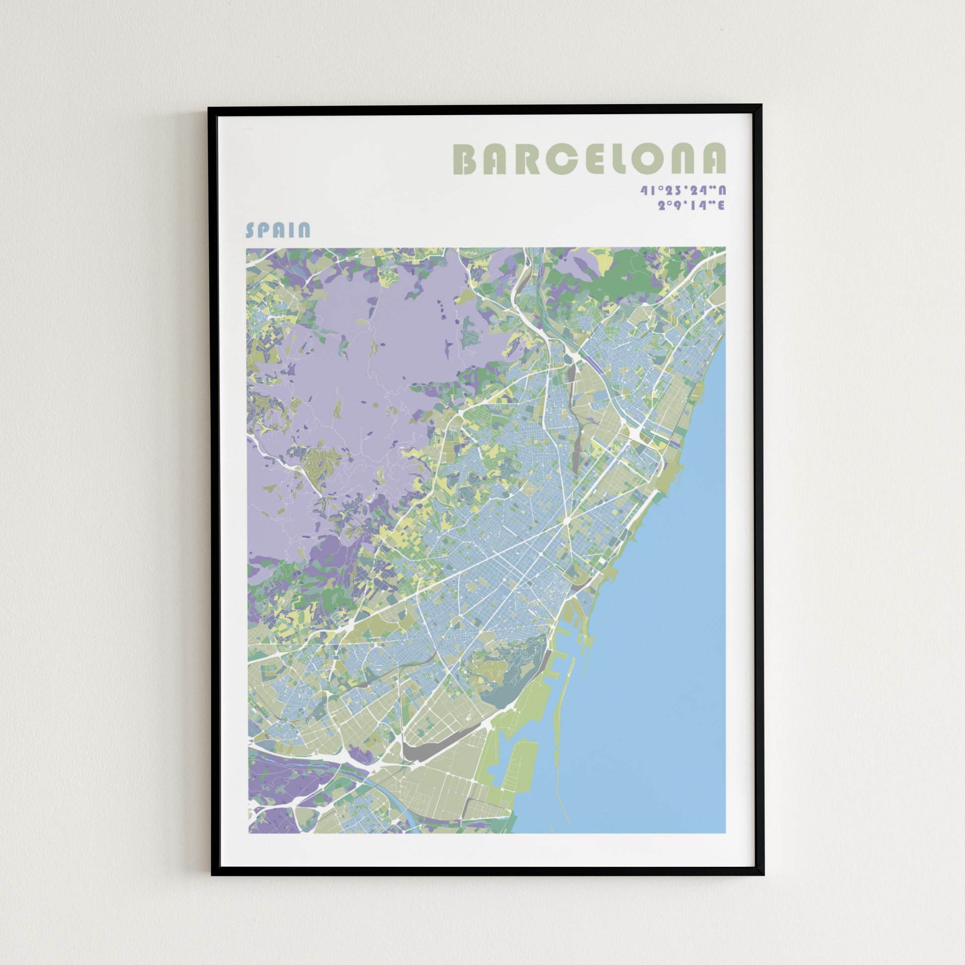 Barcelona travel map poster in a black metal frame.