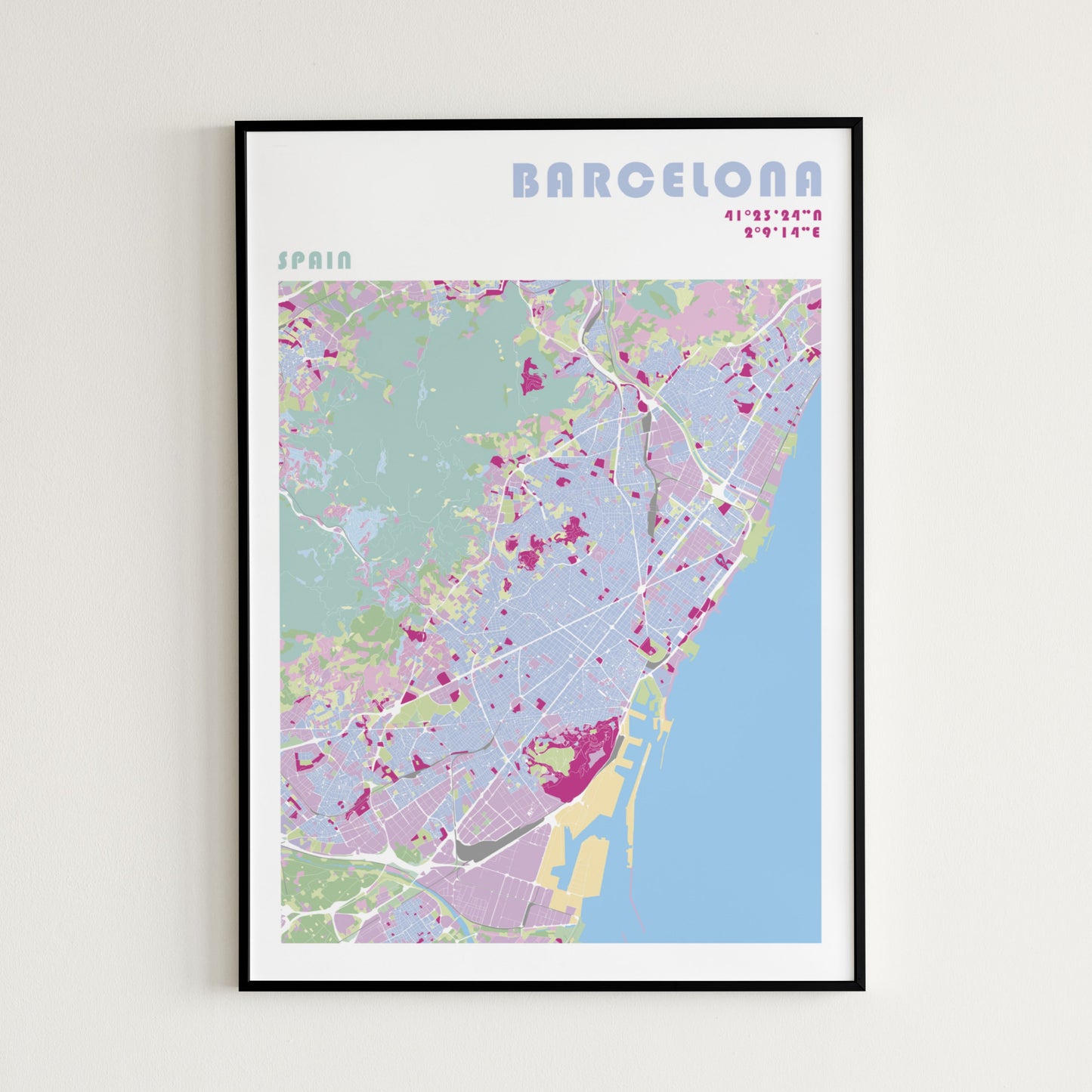 Barcelona travel map poster in a black metal frame.