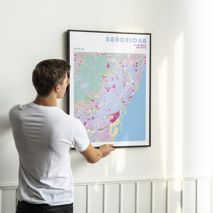 Barcelona map poster in a black metal frame.