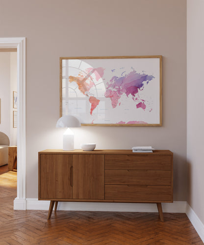 Colorful watercolour world map wall art in a wood frame.