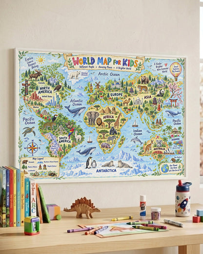 A colorful children's world map poster displayed on a light beige wall above a wooden desk with school supplies, books, and toys.