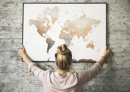 Watercolor World Map large wall art in a black metal frame.