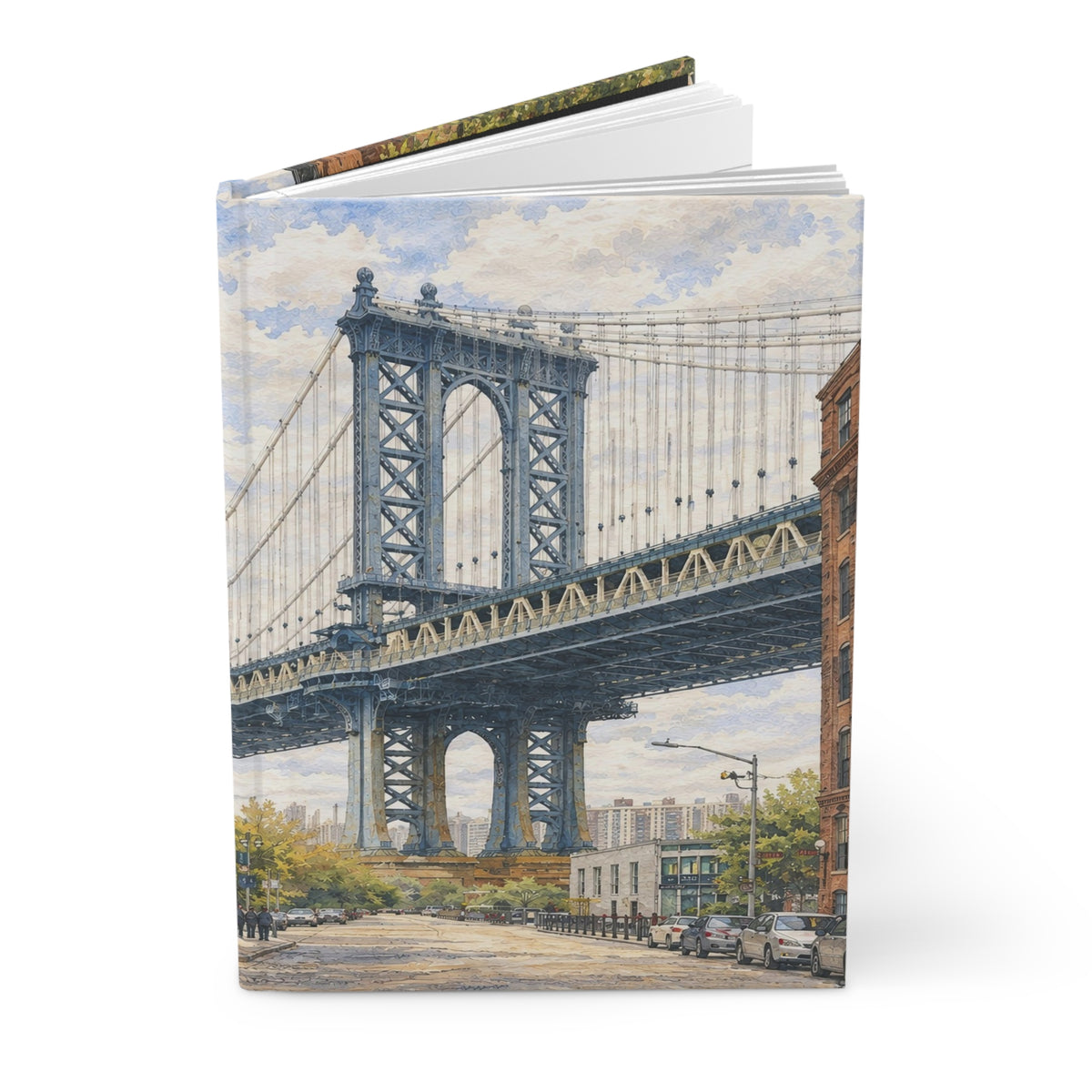 A hardcover notebook or journal standing upright, featuring a watercolor-style illustration of the Manhattan Bridge in New York City on the cover, with a white top cover and a dark spine visible against a plain white background.