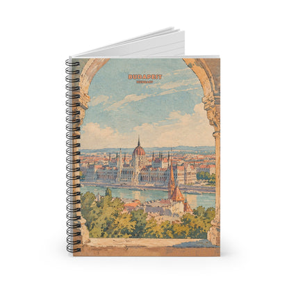 A spiral-bound notebook with a vintage-style Budapest cityscape illustration on the cover, shown standing upright on a white background.
