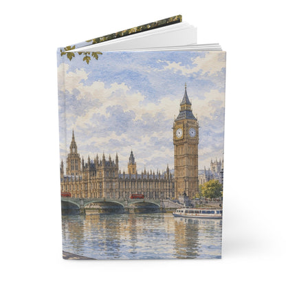 A hardcover notebook or journal standing upright, featuring a watercolor-style print of Big Ben and the London Palace on the cover. The spine is visible at the top, and the notebook is photographed on a clean white background.