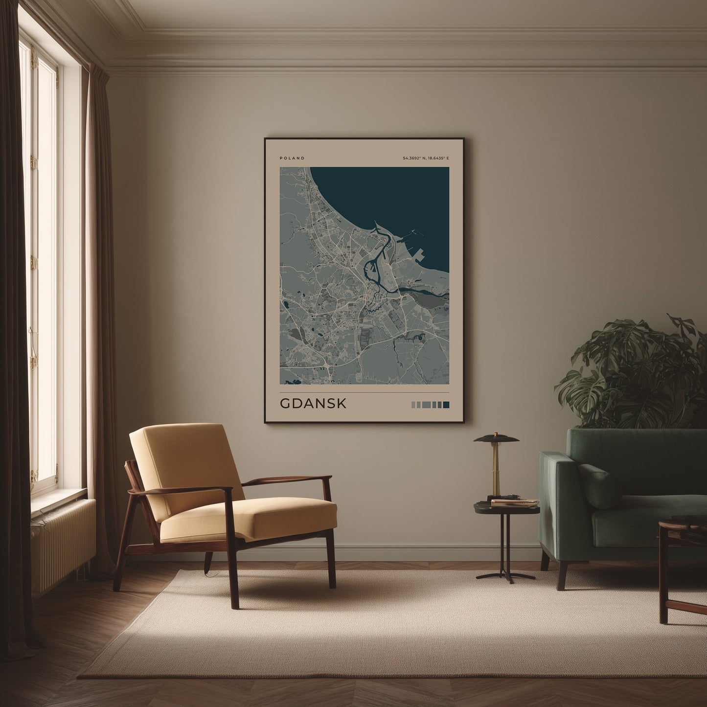 A framed minimalist city map print labeled GDANSK hangs on a beige wall in a styled living room with a cream armchair, green sofa, small side table, and window.