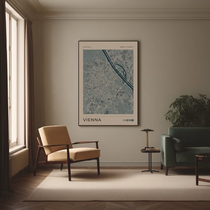 A framed art print of a Vienna street map hangs on a beige wall in a modern living room setting with a yellow armchair, green sofa, and a small side table.