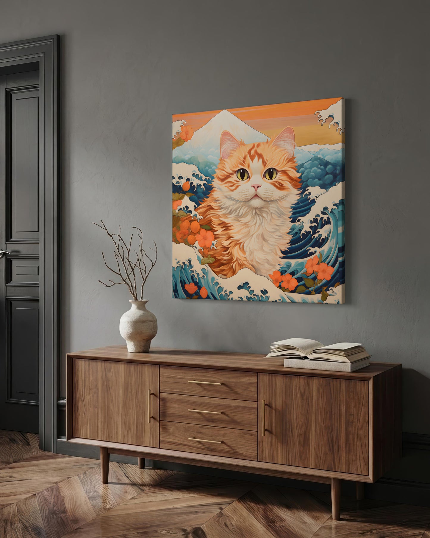 A square canvas wall art print featuring a stylized orange tabby cat in a wave-like scene with blue water, white foam, and warm orange floral elements, displayed above a wooden sideboard in a gray room.