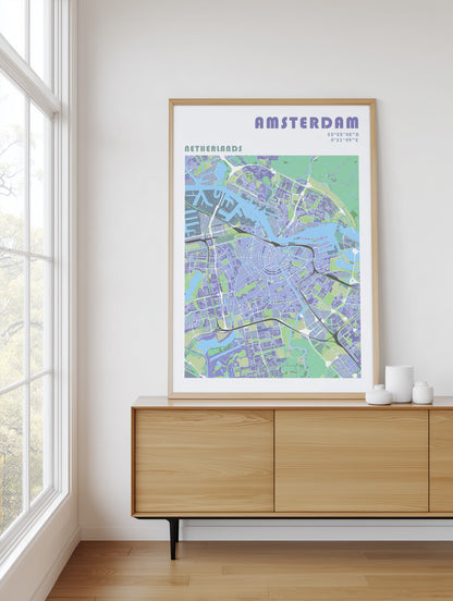 Framed map of Amsterdam on a wall above a wooden cabinet.