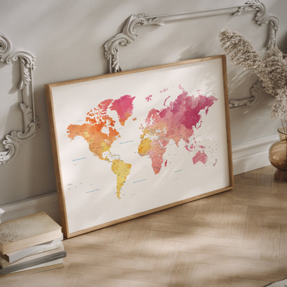 Framed world map with watercolor design on a wall